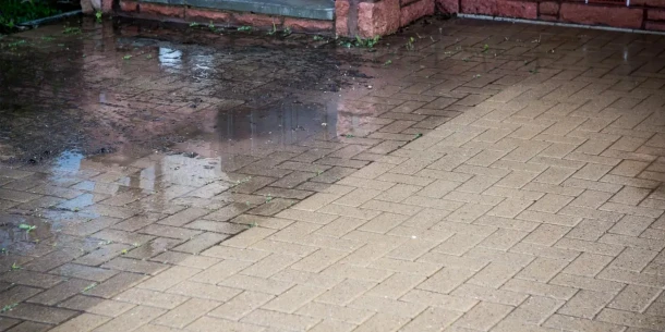 Block paving driveway in Bristol cleaned with pressure washing showing clean and dirty contrast